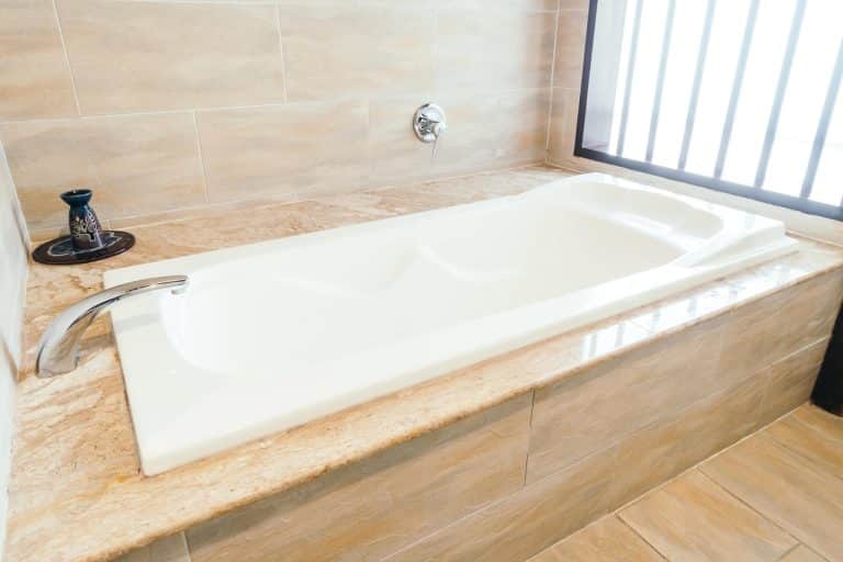 White bathtub in a budget-friendly New Orleans bathroom