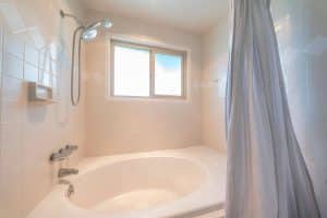 Shower tub with beige tiles