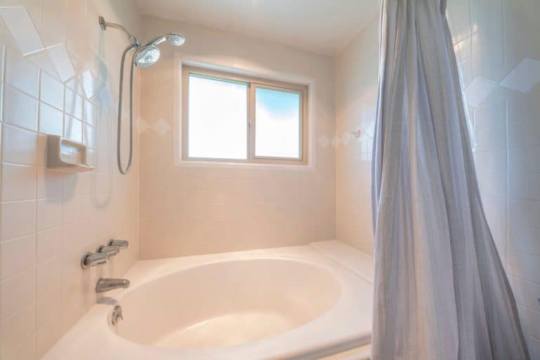Bathtub and shower before a tub-to-shower conversion in New Orleans