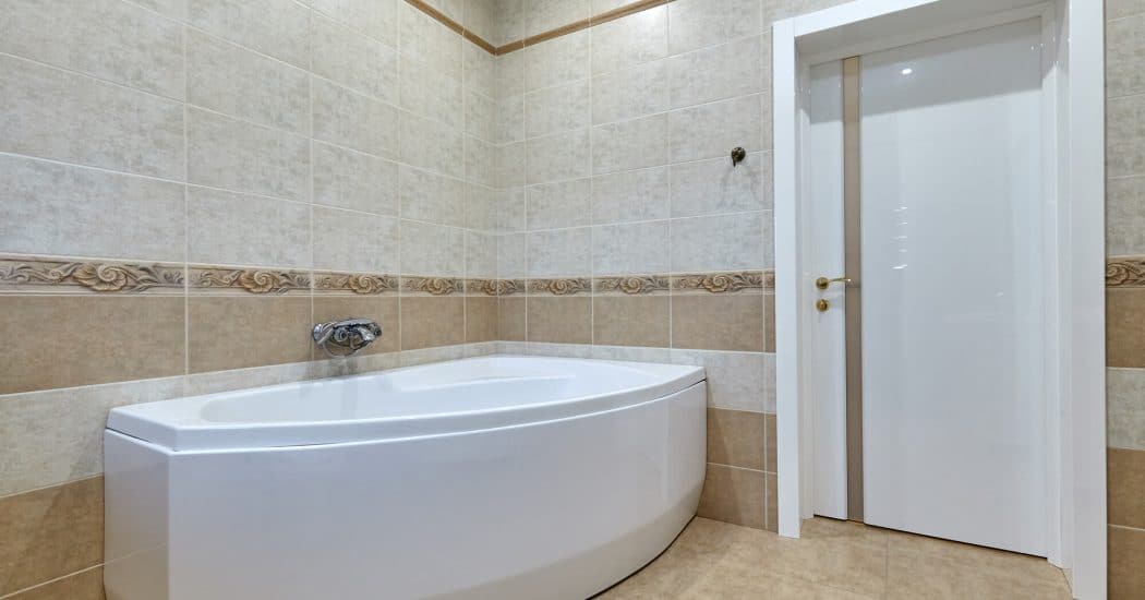 Remodeled bathroom with a corner tub in New Orleans