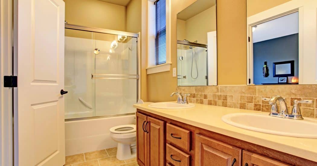 Remodeled bathroom with a shower and tub in New Orleans