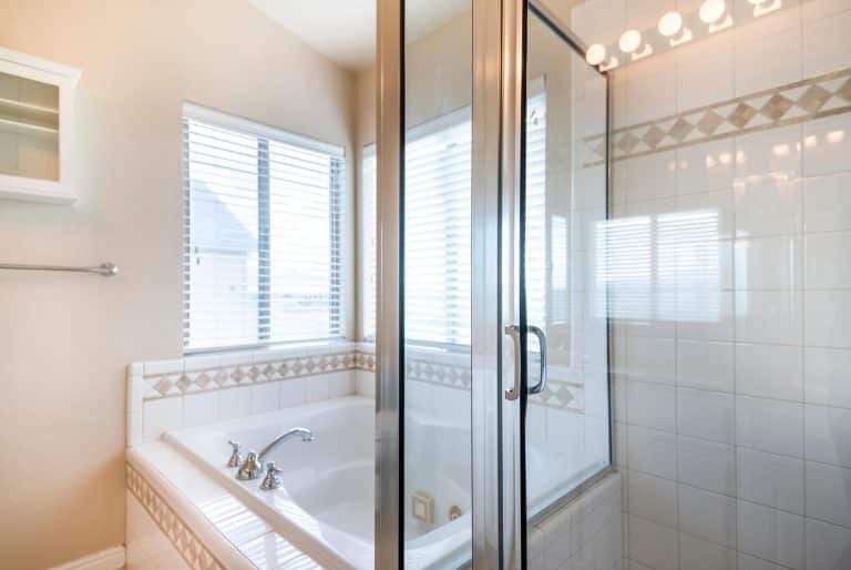 Bathroom featuring a walk-in tub and vanity designed for aging in place