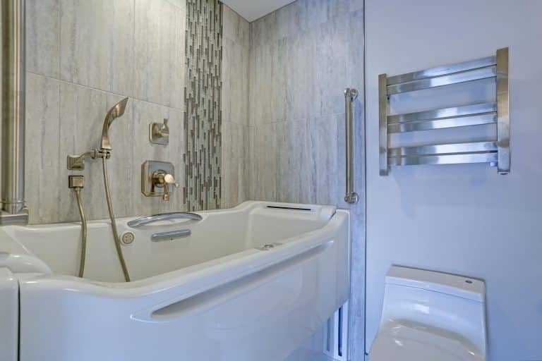 Walk-in tub with grab bars for seniors in New Orleans