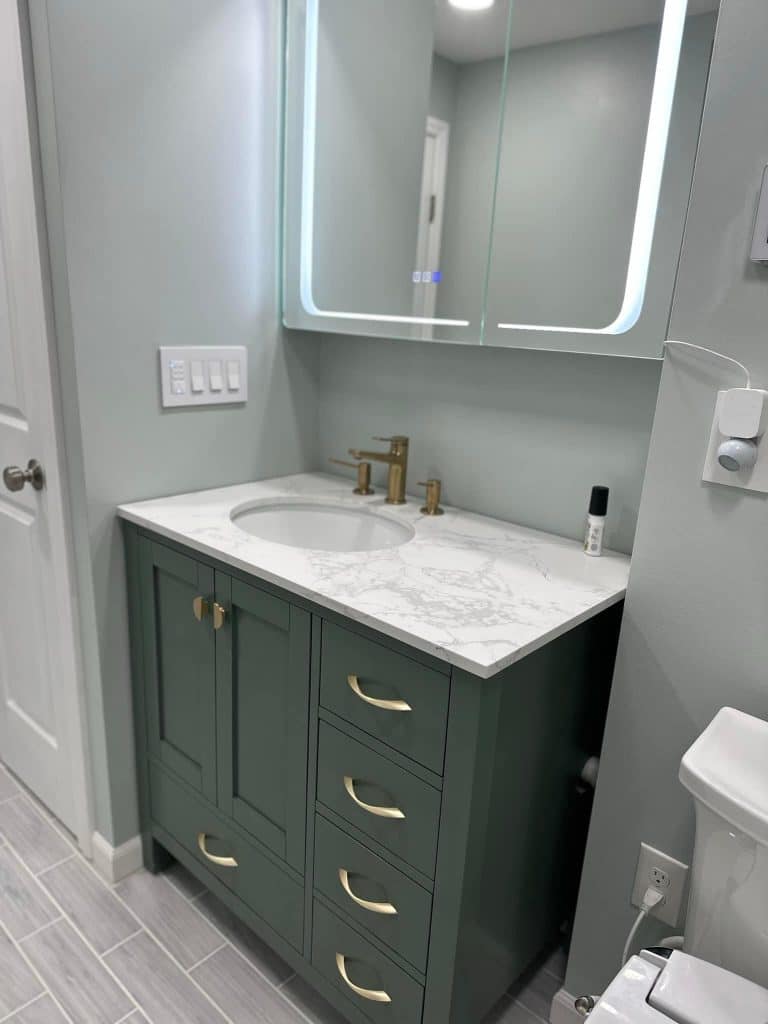 Sink with cabinets and mirror - Turnkey Bath Remodel
